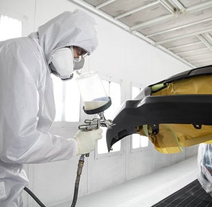 Collision Center Technician Painting a Vehicle | Sansone Toyota in Woodbridge NJ